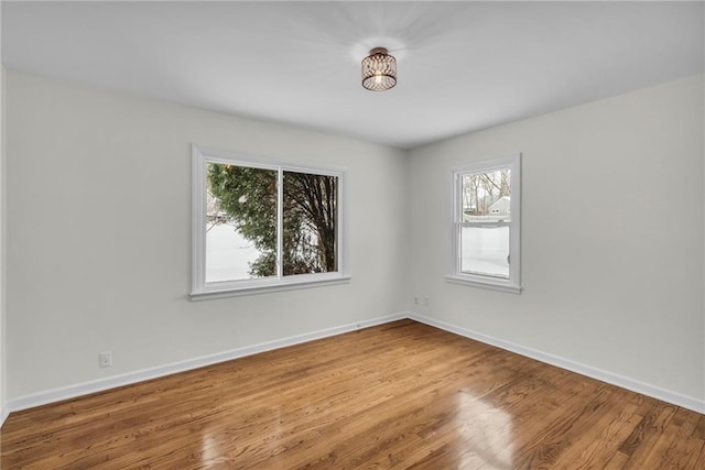 unfurnished room featuring wood-type flooring