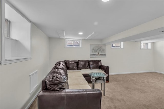 living room featuring light colored carpet and a healthy amount of sunlight