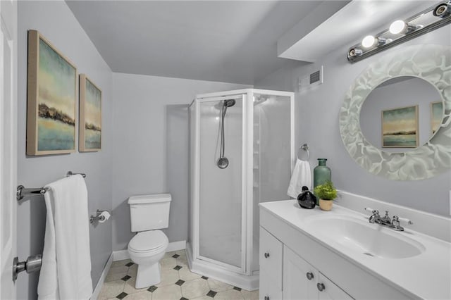 bathroom with toilet, vanity, and walk in shower