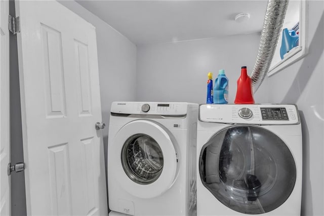 laundry area with washer and clothes dryer