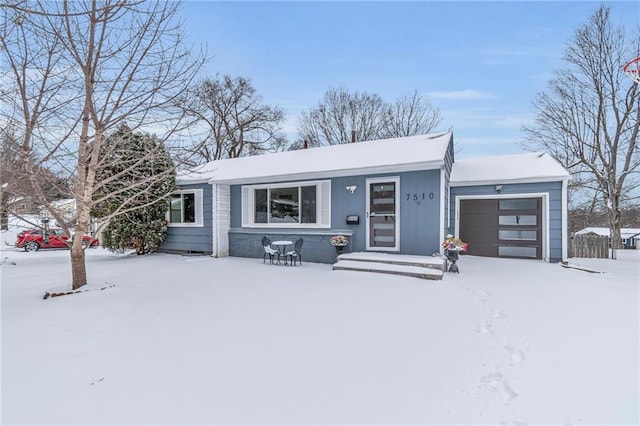 single story home featuring a garage