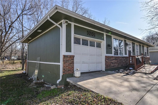 view of side of home featuring a garage