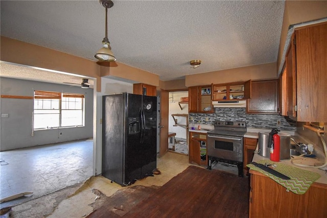 kitchen with hanging light fixtures, backsplash, a textured ceiling, stainless steel electric range, and black fridge with ice dispenser