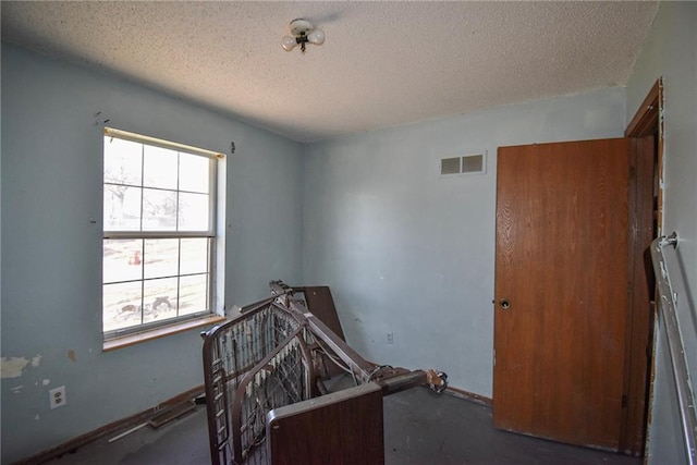 bedroom featuring a textured ceiling