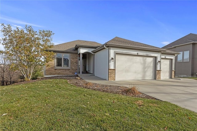 view of front facade with a garage and a front lawn