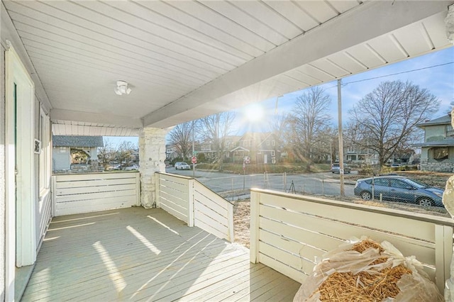 wooden deck featuring covered porch