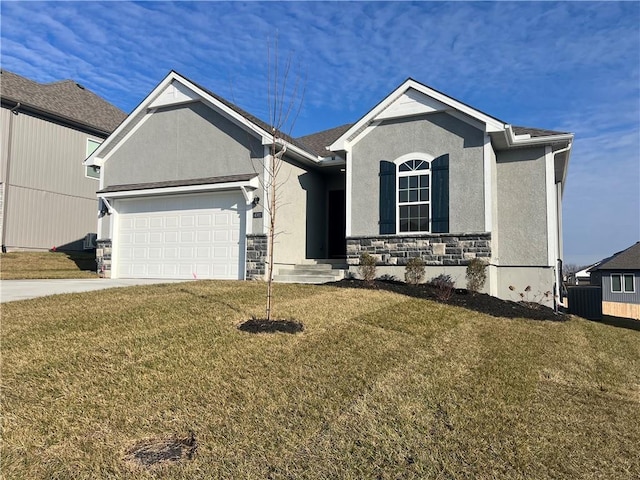 view of front of home with a garage and a front lawn