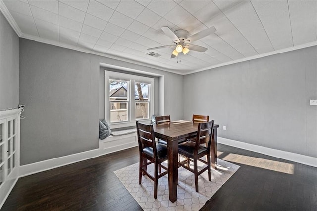 dining room featuring ceiling fan, dark hardwood / wood-style flooring, and ornamental molding