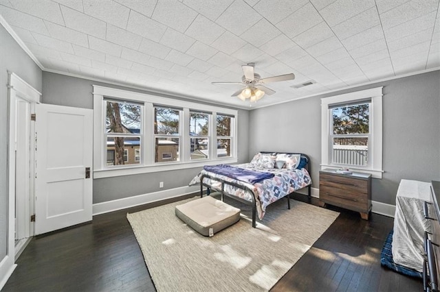 bedroom with multiple windows, ceiling fan, crown molding, and dark hardwood / wood-style flooring