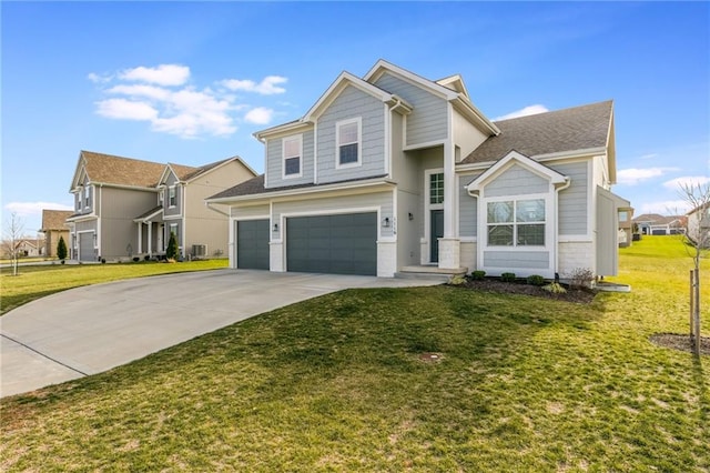 view of front of house featuring a garage and a front lawn