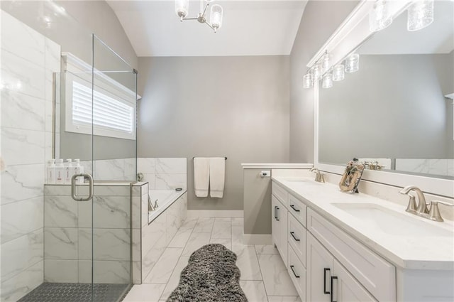 bathroom featuring vanity, lofted ceiling, and independent shower and bath