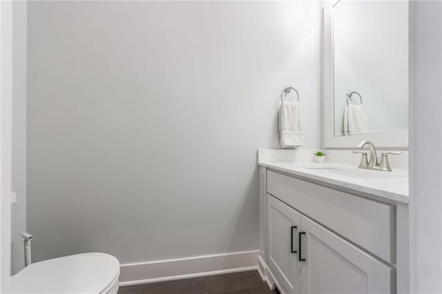 bathroom with vanity and toilet