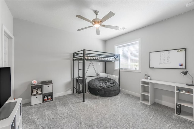 bedroom with ceiling fan and carpet floors