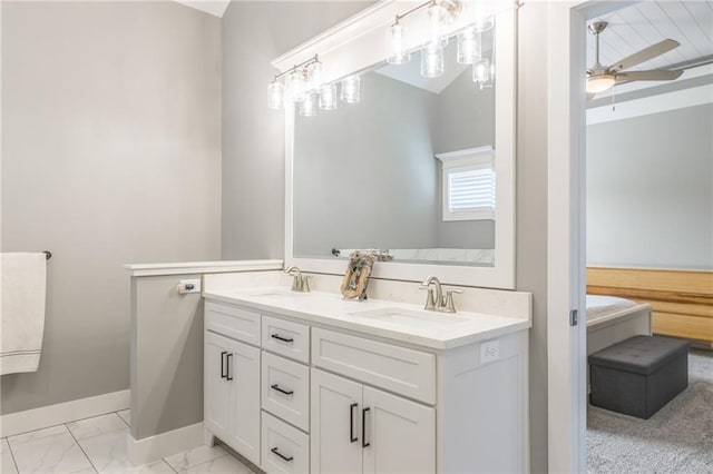 1116 SW Whispering Willow Way, Lees Summit, MO 64064 - bathroom featuring double vanity, a ceiling fan, marble finish floors, and baseboards