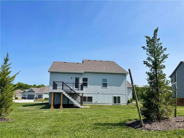 1116 SW Whispering Willow Way, Lees Summit, MO 64064 - back of property with stairway, a deck, a lawn, and roof with shingles