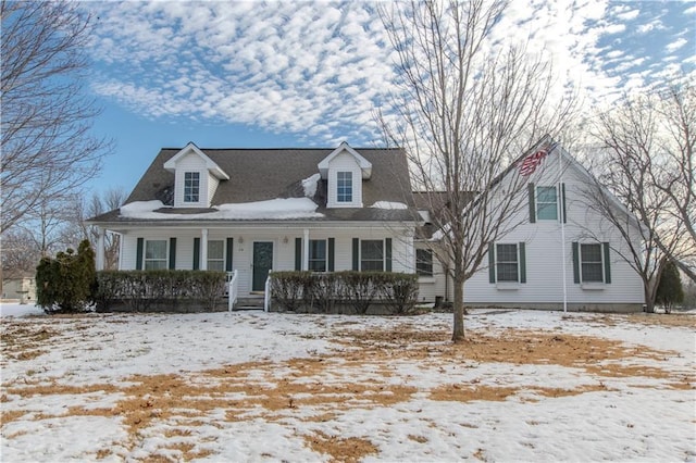 cape cod-style house with a porch