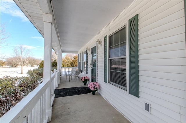 balcony featuring a porch