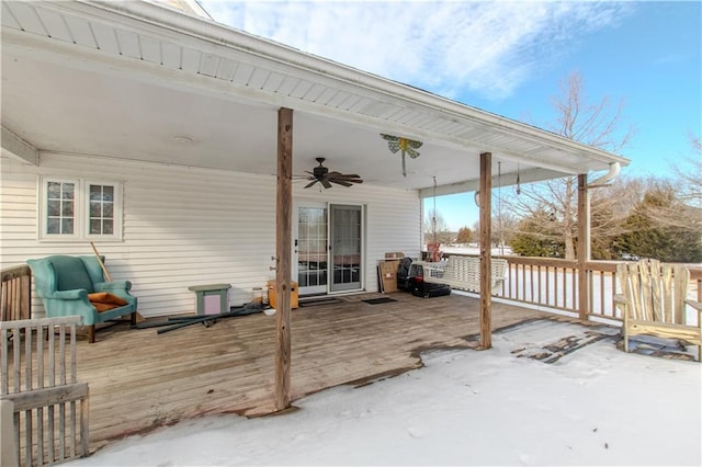 wooden deck featuring ceiling fan