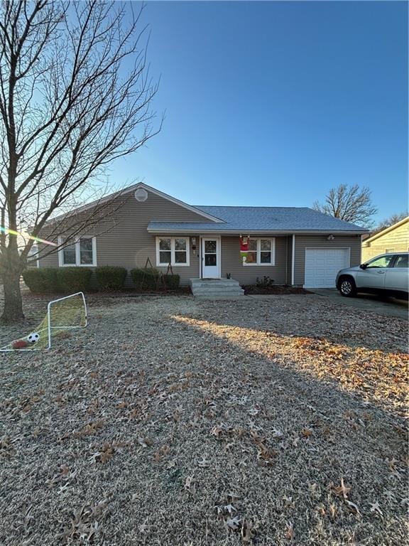 ranch-style house featuring a garage