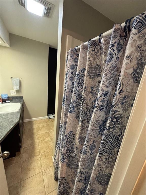 bathroom featuring tile patterned floors and vanity