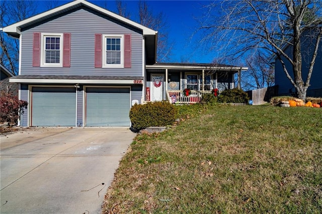 split level home featuring a front lawn, a porch, and a garage