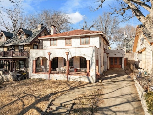 view of front of home featuring a balcony and a porch