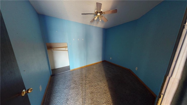 unfurnished bedroom featuring ceiling fan, lofted ceiling, carpet floors, and a closet