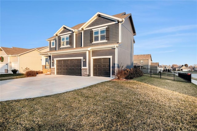 view of front facade with a front yard and a garage