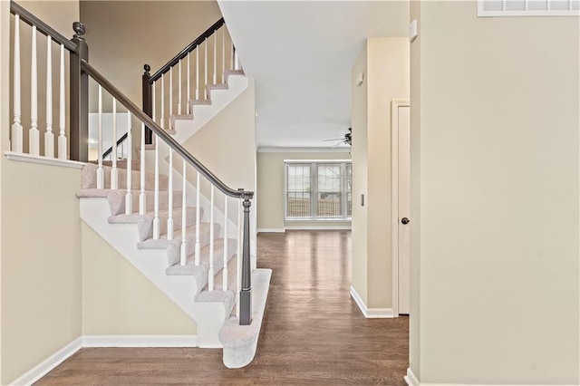 entrance foyer featuring ceiling fan and hardwood / wood-style flooring