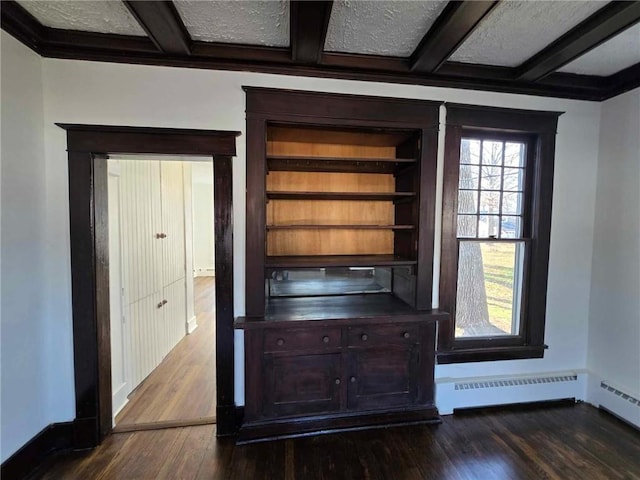 details with wood-type flooring, a textured ceiling, and baseboard heating