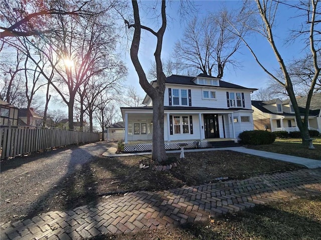 view of front of property with a porch and a garage