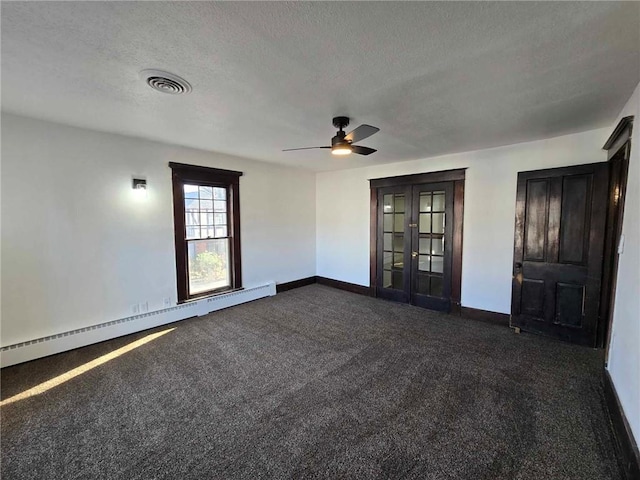 carpeted spare room featuring a textured ceiling, a baseboard radiator, and ceiling fan