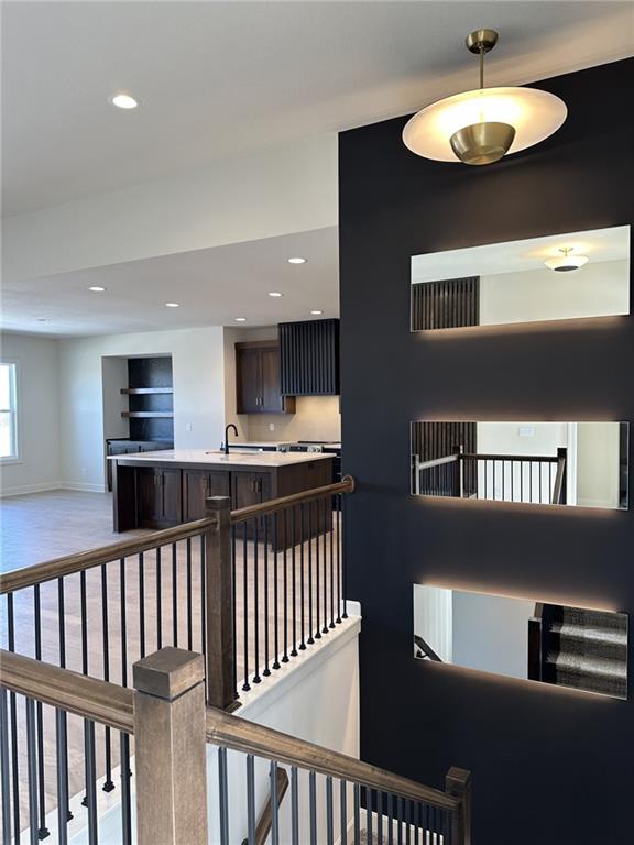 interior space with baseboards and recessed lighting