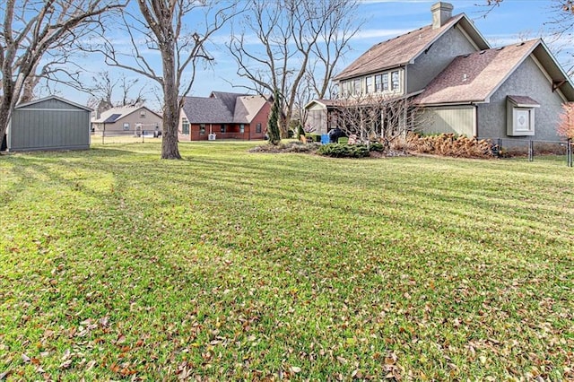 view of yard featuring a storage unit