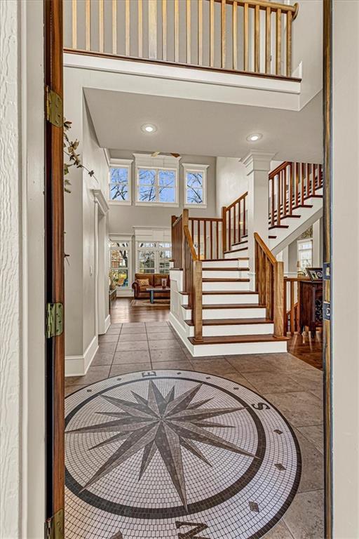 tiled foyer entrance featuring a high ceiling