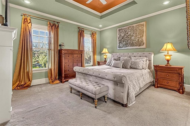 bedroom with multiple windows, carpet floors, ceiling fan, and crown molding