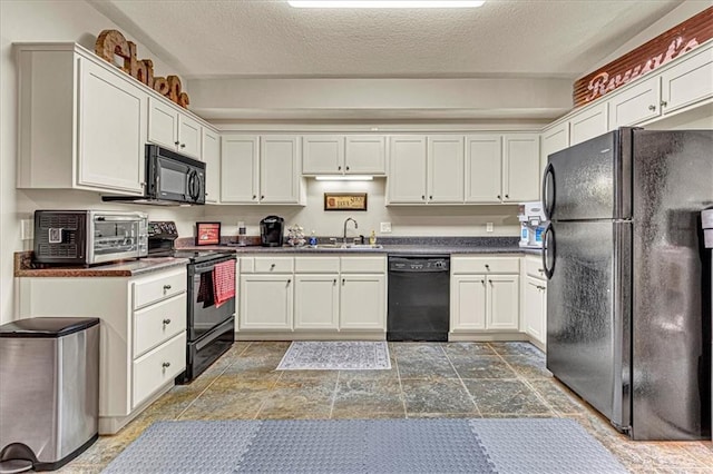 kitchen with black appliances, white cabinets, sink, and a textured ceiling