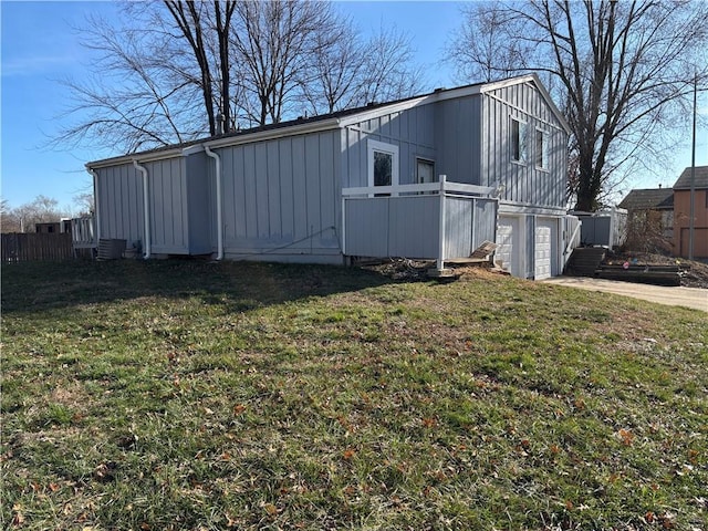 view of property exterior featuring a yard and a garage