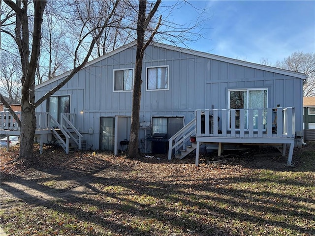 rear view of property featuring a deck