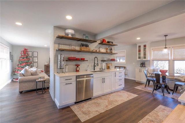 bar with dishwasher, pendant lighting, white cabinetry, and dark wood-type flooring