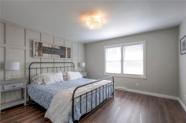 bedroom featuring dark hardwood / wood-style flooring