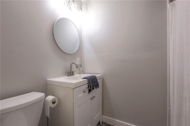 bathroom featuring vanity and toilet