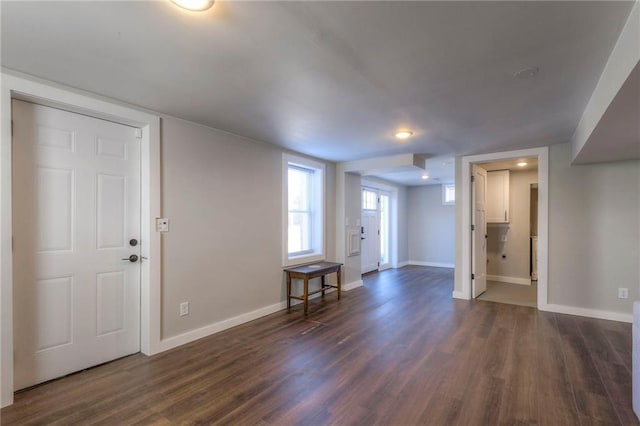 foyer with dark hardwood / wood-style flooring