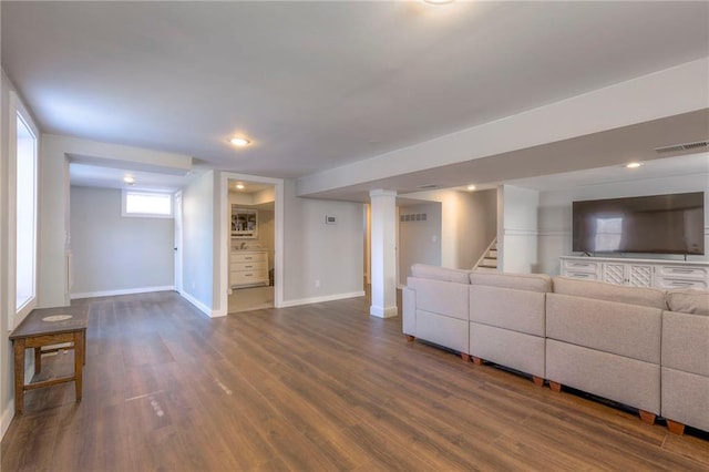 unfurnished living room with dark hardwood / wood-style floors