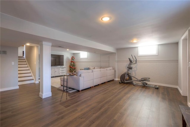 unfurnished living room with dark hardwood / wood-style floors