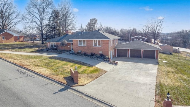 ranch-style home with a garage, an outdoor structure, and a front lawn