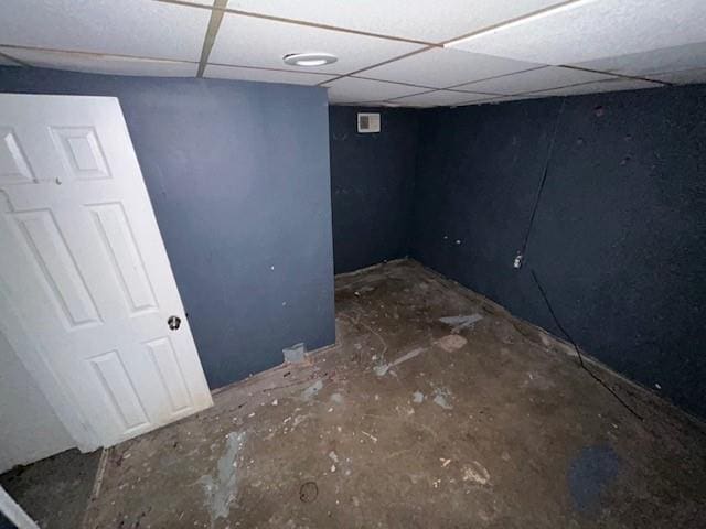 basement featuring a paneled ceiling