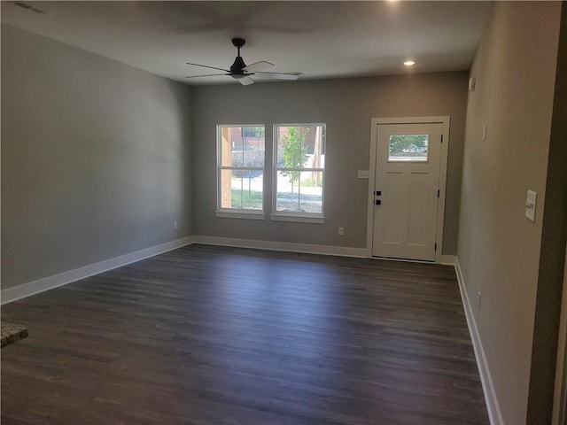 entryway featuring ceiling fan and dark wood-type flooring