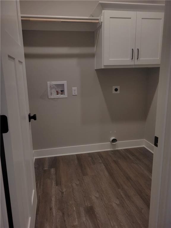 laundry area featuring electric dryer hookup, dark hardwood / wood-style flooring, hookup for a washing machine, and cabinets