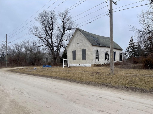 view of property exterior with crawl space